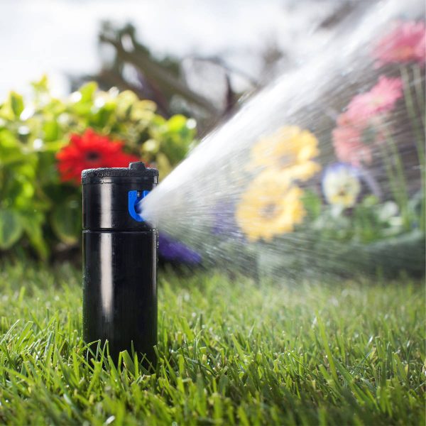 Hunter PGP ULTRA Pop-Up Rotor Sprinkler installed in green space in operation